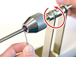 Tool being cranked while coiling wire